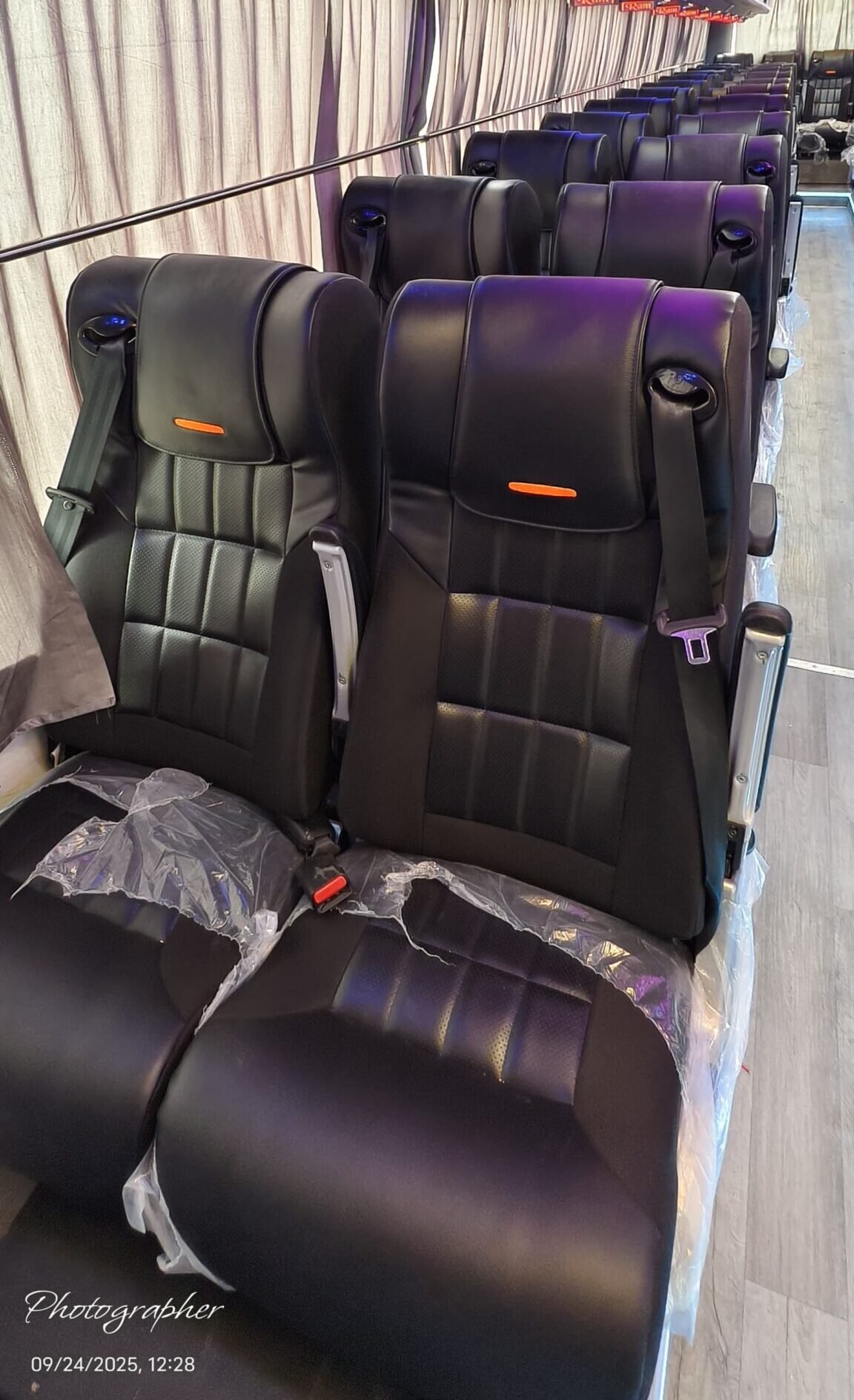 Wide recliner seats with armrests and leg support